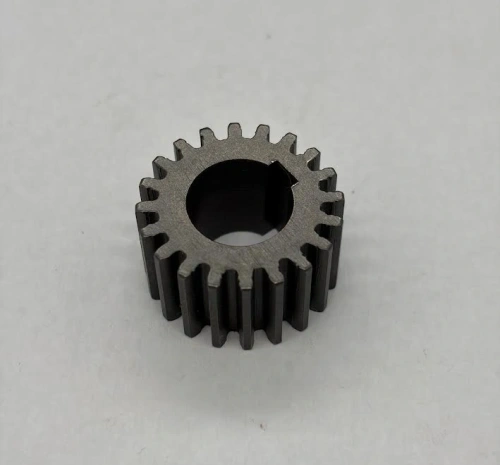 Timing pinion on flywheel axle